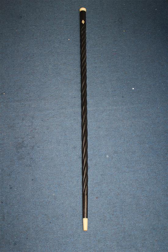 A late 19th / early 20th century ebony spiral twist turned walking cane, 37.25in.